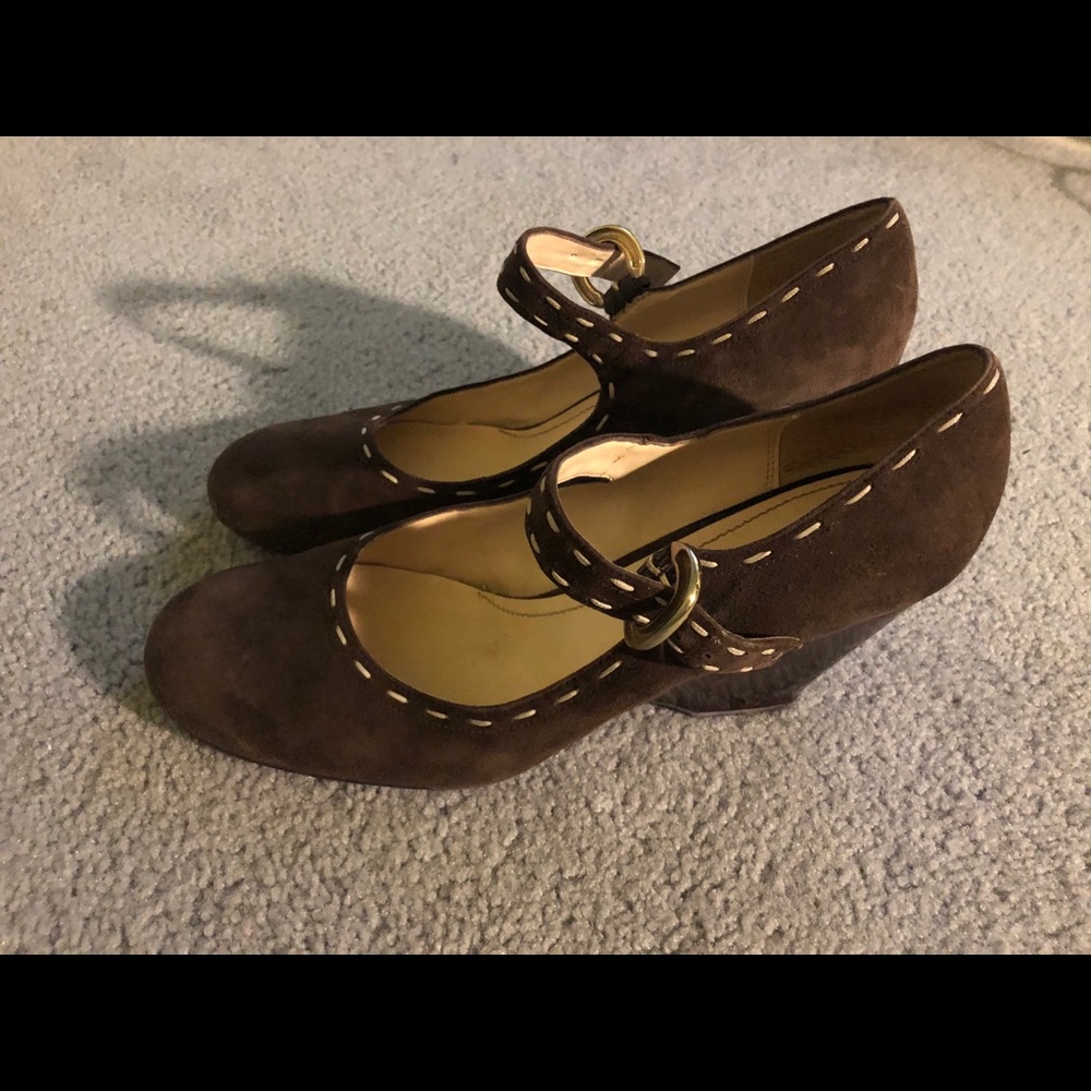 Brown suede wedge heeled Mary Janes.